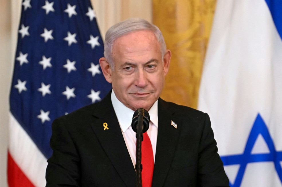 Netanyahu durante coletiva à imprensa na Casa Branca, após encontro com Trump — Foto: Jim Watson / AFP